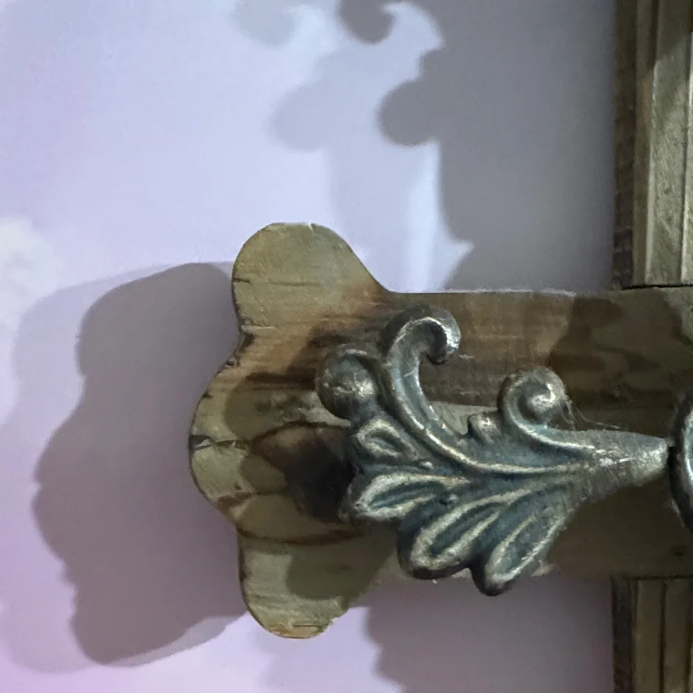 Rustic Wooden Cross with Golden Accents and Red Gem